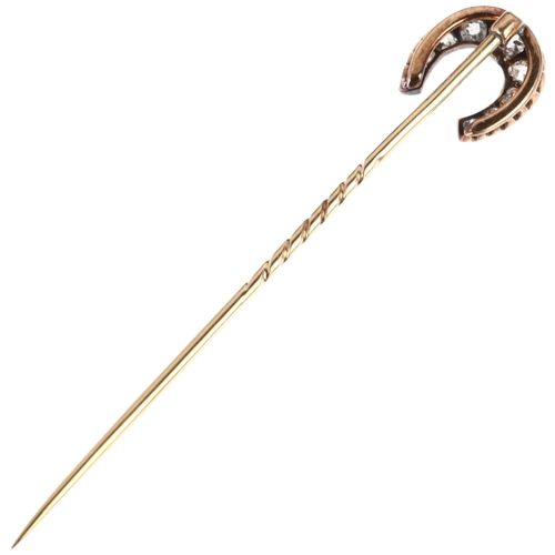 1231 - A 19th century diamond horseshoe stickpin, claw set with old-cut diamonds, total diamond content app... 