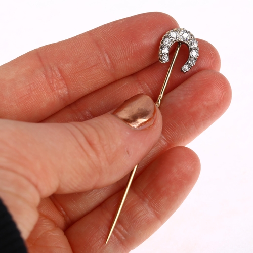 1231 - A 19th century diamond horseshoe stickpin, claw set with old-cut diamonds, total diamond content app... 