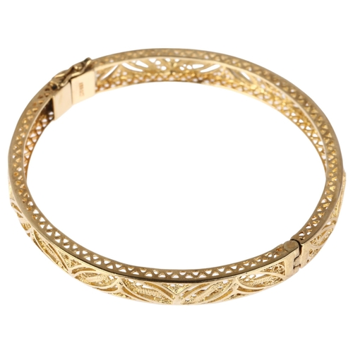 1233 - A 9ct gold filigree hinged bangle, maker ARR, band width 6.7mm, internal circumference 17cm, 12.5g