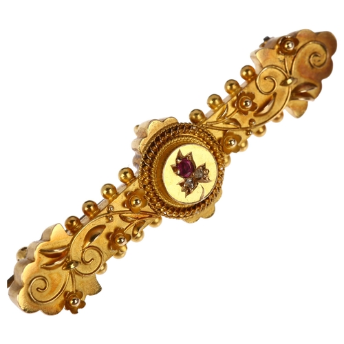 1237 - A Victorian 15ct gold ruby and diamond Etruscan Revival brooch, circa 1890, central floral motif wit... 