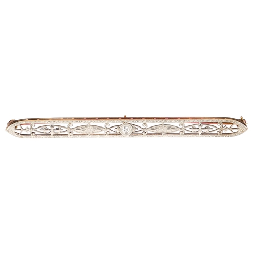 1239 - An Art Deco French 14ct gold diamond openwork brooch, circa 1920, floral engraved and pierced decora... 