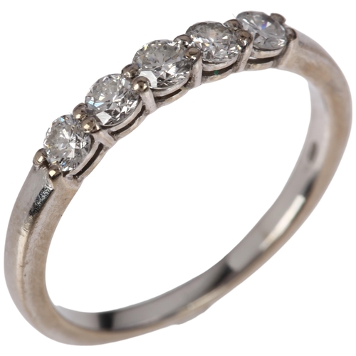 1253 - A modern 18ct white gold five stone diamond quarter eternity ring, claw set with modern round brilli... 