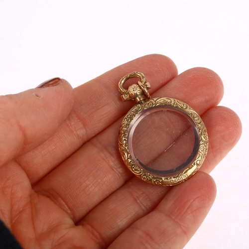 1258 - An early 20th century 9ct gold double-sided photo locket pendant, maker WHC, Chester 1905, 37.4mm, 5... 