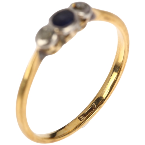 1259 - An early 20th century 18ct gold three stone sapphire and diamond ring, total diamond content approx ... 