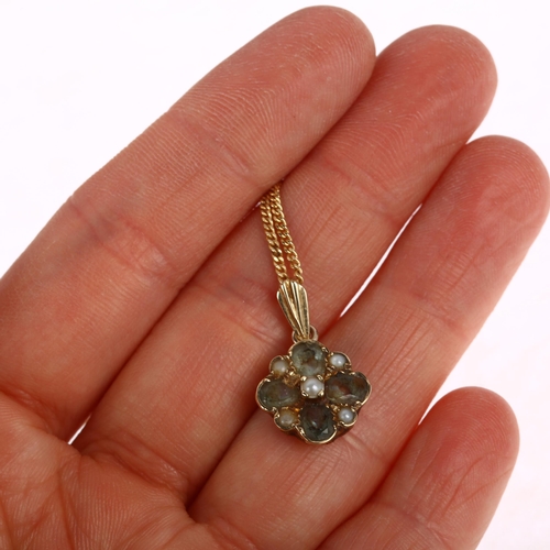 1262 - A 9ct gold gem set flowerhead pendant necklace, on 9ct fine curb link chain, pendant 21.8mm, chain 4... 