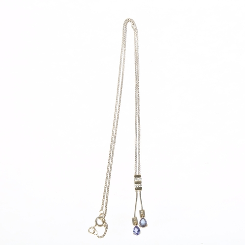 1268 - A modern 18ct white gold tanzanite and diamond negligee pendant necklace, claw set with pear-cut tan... 