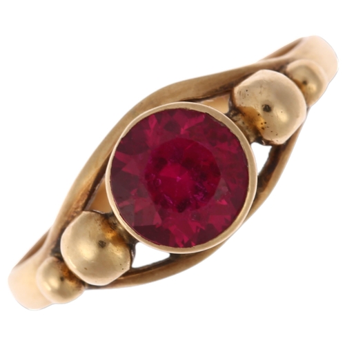 1273 - A late 20th century Middle Eastern synthetic ruby ring, apparently unmarked, setting height 7.1mm, s... 