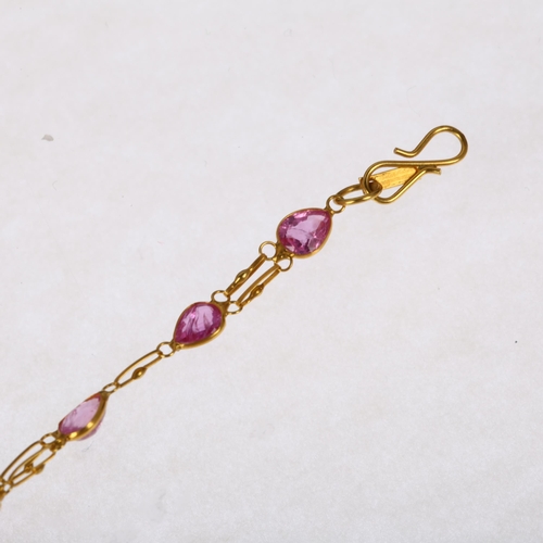 1274 - A 14ct gold pink sapphire tennis line bracelet, rub-over set with pear-cut sapphires, 16cm, 1.7g