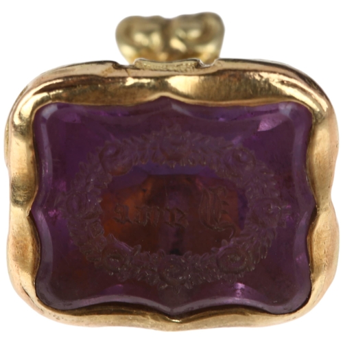 1277 - A 19th century amethyst 'Jane' seal fob, intaglio carved with name within laurel wreath, unmarked ye... 