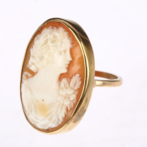 1280 - A large mid-20th century shell cameo ring, relief carved depicting Art Nouveau female profile, appar... 