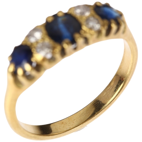 1285 - An early 20th century 18ct gold seven stone sapphire and diamond half hoop ring, set with oval and r... 