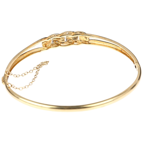 1287 - A late 20th century 9ct gold diamond curb link hinged bangle, import London 1987, setting height 7.4... 