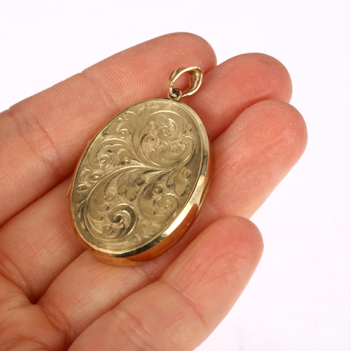 1288 - A modern 9ct gold photo locket pendant, maker PP Ltd, foliate engraved decoration, 42mm, 11.5g gross