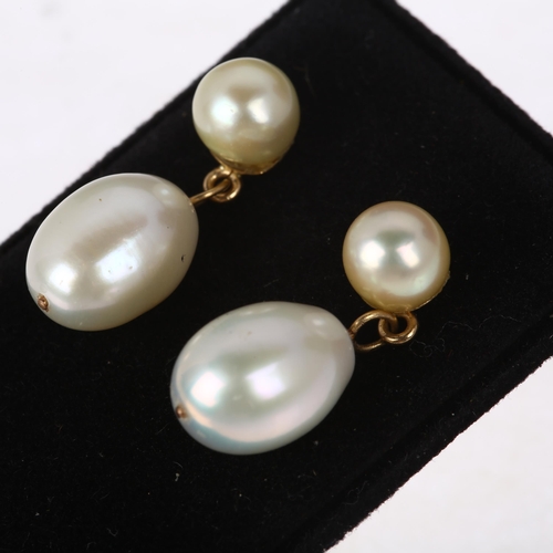 1297 - A pair of cultured pearl drop earrings, unmarked yellow metal stud fittings, 21.5mm, 3.4g