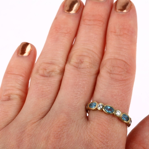 1299 - A modern 9ct gold blue topaz and diamond half eternity ring, setting height 4.45mm, size V, 3.2g