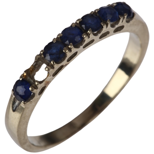 1300 - A modern 18ct white gold sapphire half eternity ring, claw set with round-cut sapphires, setting hei... 