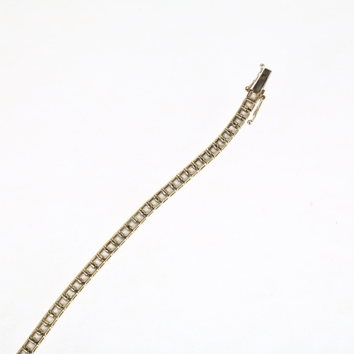 1312 - A modern 9ct gold cubic zirconia tennis line bracelet, 19cm, 9.8g