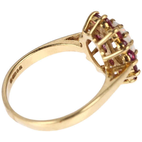 1313 - A late 20th century 9ct gold opal and ruby oval cluster ring, London 1978, claw set with oval caboch... 