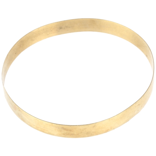 1318 - A late 20th century 9ct gold slave bangle, band width 9.4mm, internal circumference 21.5cm, 12.4g