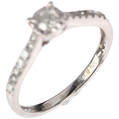 1320 - A modern 9ct white gold solitaire diamond ring, illusion set with modern round brilliant-cut diamond... 