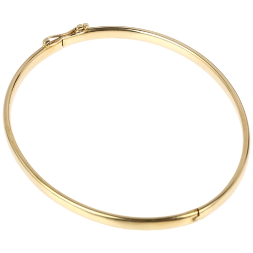 1323 - A Continental 14ct gold hinged bangle, by Midas, band width 3.8mm, internal circumference 18cm, 7.5g