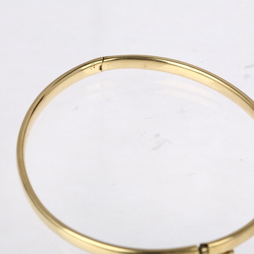 1323 - A Continental 14ct gold hinged bangle, by Midas, band width 3.8mm, internal circumference 18cm, 7.5g