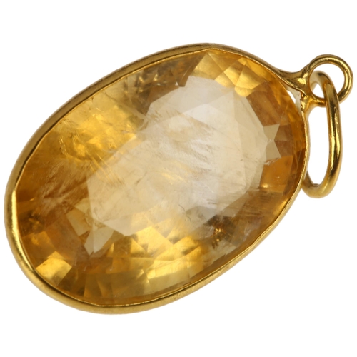 1325 - A modern 14ct gold citrine drop pendant, rub-over set with oval mixed-cut citrine, 21.7mm, 1.2g