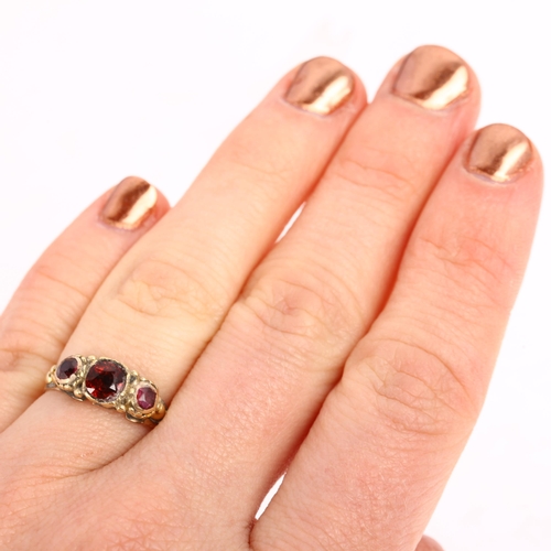 1343 - An early 20th century three stone garnet half hoop ring, apparently unmarked, setting height 6mm, si... 