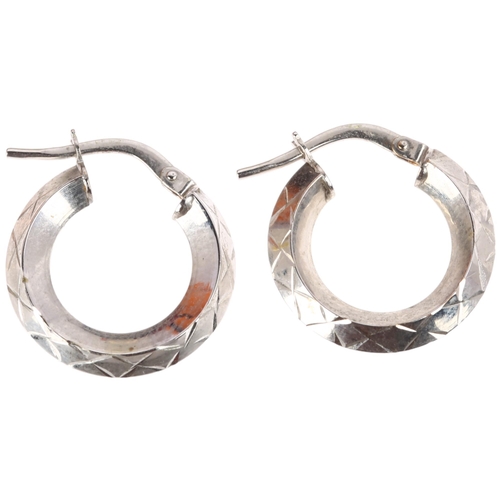 1352 - A pair of 9ct white gold hoop earrings, engraved cross decoration, with French lock fittings, 16.9mm... 