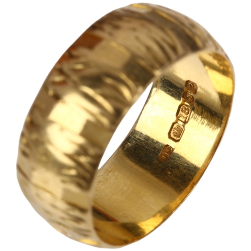 1357 - A late 20th century 18ct gold wedding band ring, maker J Ltd, London 1970, textured decoration, band... 