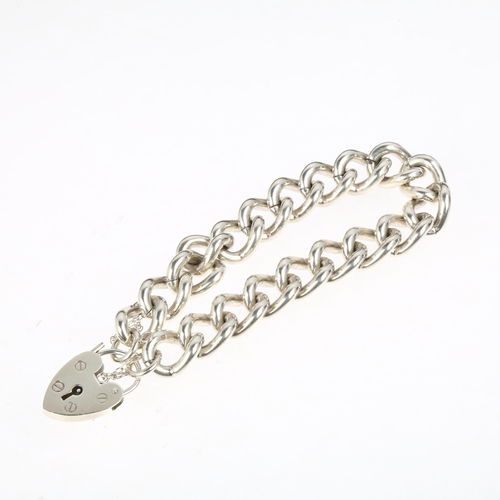 1393 - A heavy late 20th century silver solid curb link chain bracelet, maker CB Ltd, Birmingham 1978, with... 