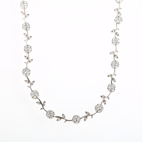 1403 - A modern sterling silver cubic zirconia flowerhead line necklace, 44cm, 29.8g