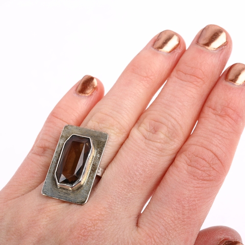 1406 - A late 20th century smoky quartz panel ring, circa 1970s, unmarked silver naturalistic bark settings... 