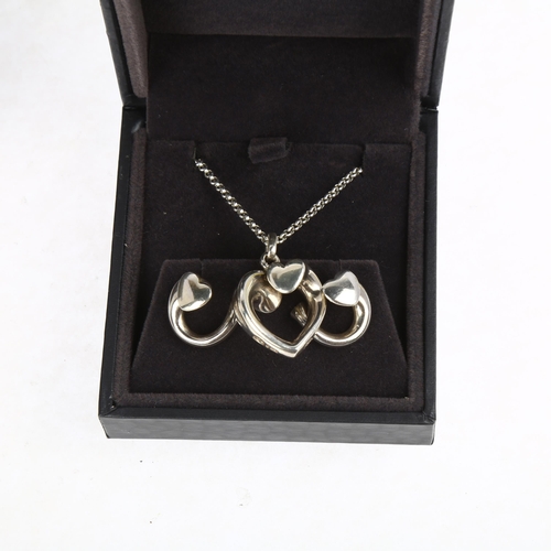 1411 - GEORG JENSEN - a a Danish sterling silver Artist Heart pendant necklace and earring set, designed by... 