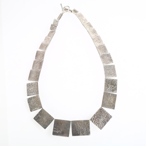 1424 - JOHN GRENVILLE - a mid-20th century modernist sterling silver graduated abstract panel link necklace... 