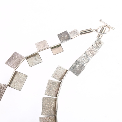 1424 - JOHN GRENVILLE - a mid-20th century modernist sterling silver graduated abstract panel link necklace... 