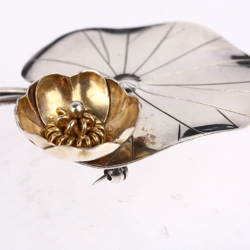 1430 - ANTON MICHELSEN - a Danish modernist sterling silver and silver-gilt lily pad brooch, designed by Ge... 