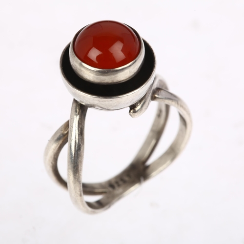 1439 - A Danish modernist sterling silver carnelian cup ring, in the style of Niels Erik From, circa 1960s,... 