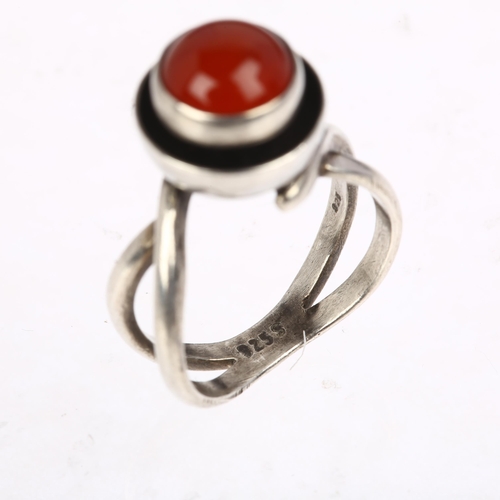 1439 - A Danish modernist sterling silver carnelian cup ring, in the style of Niels Erik From, circa 1960s,... 