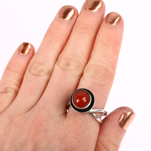 1439 - A Danish modernist sterling silver carnelian cup ring, in the style of Niels Erik From, circa 1960s,... 