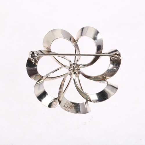 1446 - NIELS ERIK FROM - a Danish modernist sterling silver flowerhead openwork brooch, 39.3mm, 6.4g