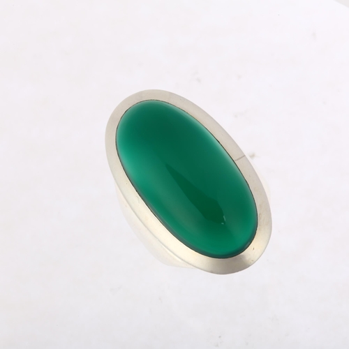 1463 - A large sterling silver green chalcedony dress ring, rub-over set with large oval cabochon chalcedon... 