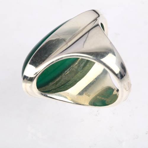 1463 - A large sterling silver green chalcedony dress ring, rub-over set with large oval cabochon chalcedon... 