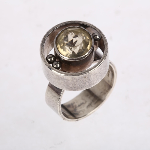 1470 - NIELS ERIK FROM - a Danish modernist sterling silver and rock crystal openwork target ring, setting ... 