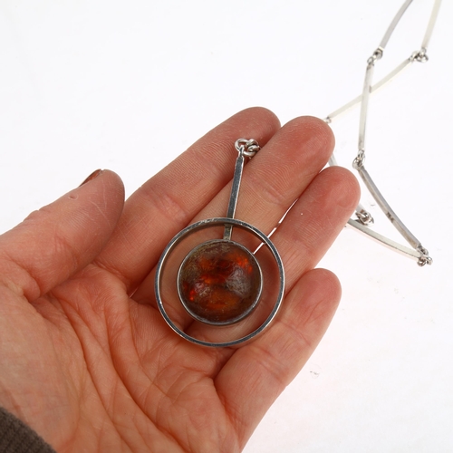 1474 - NIELS ERIK FROM - a Danish modernist sterling silver and amber openwork pendant necklace, set with r... 