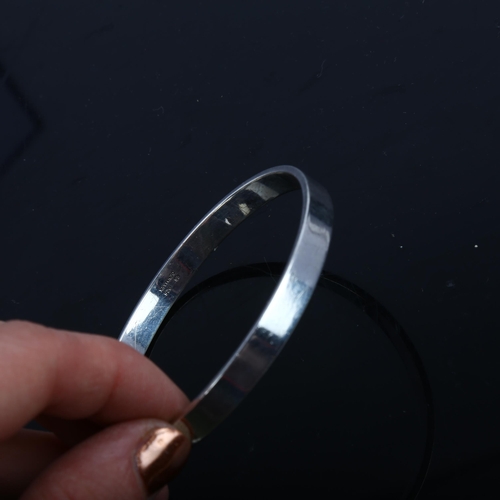 1475 - RUDOLF ANDRESEN - a Danish silver plain form slave bangle, band width 6.6mm, internal circumference ... 