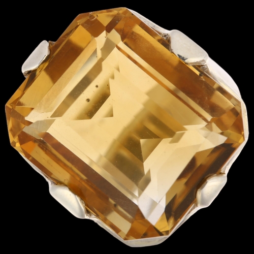 1483 - A large sterling silver citrine dress ring, setting height 23.2mm, size R, 17.4g