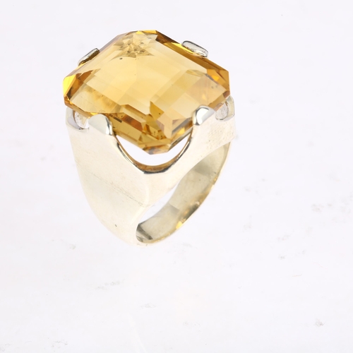 1483 - A large sterling silver citrine dress ring, setting height 23.2mm, size R, 17.4g