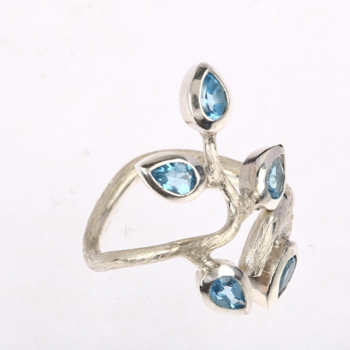 1485 - A large sterling silver blue topaz naturalistic branch dress ring, rub-over set with pear-cut topaz ... 