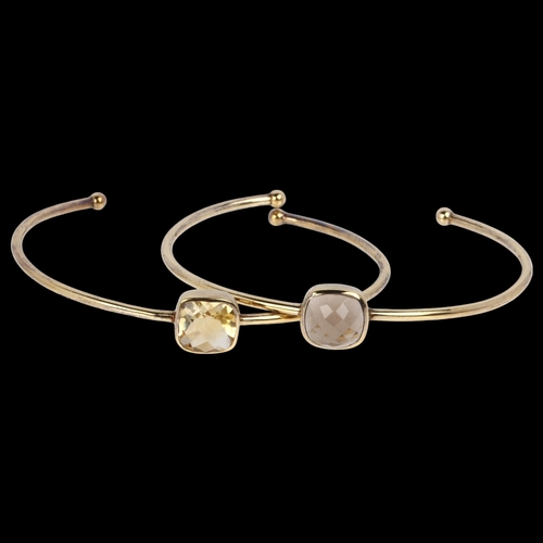 1489 - DINNY HALL - a pair of designer sterling silver-gilt gem set torque bangles, comprising smoky quartz... 